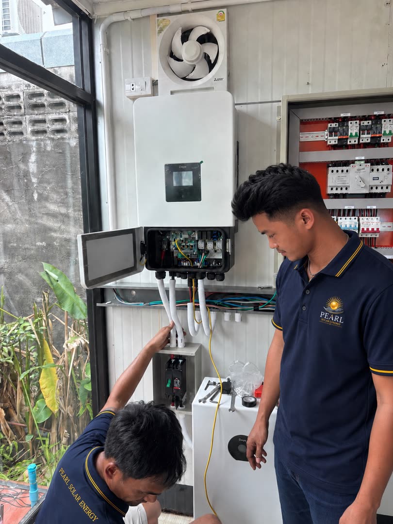 Pearl Solar Energy technicians installing a 20 kW hybrid solar system