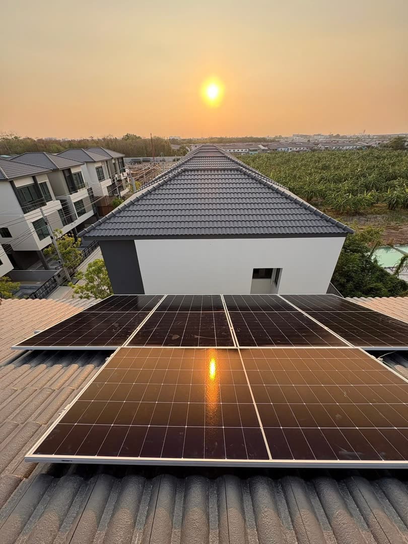 Solar panels on the roof of a private home in Koh Kaew, Phuket at sunset
