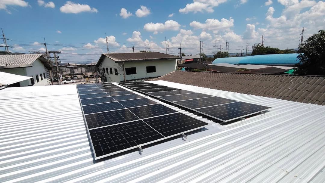 10 kW solar array on the metal-sheet roof of a warehouse in Natai, Phang Nga